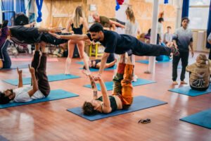 Two people practicing partner yoga